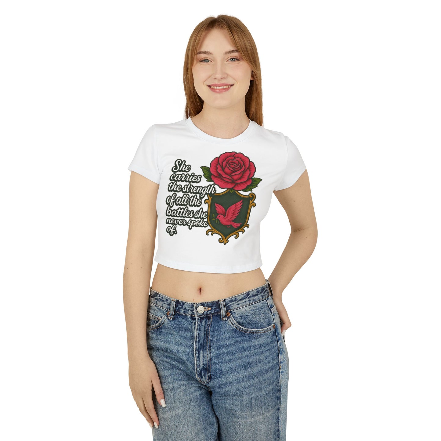 SHE CARRIES THE STRENGTH OF ALL THE BATTLES SHE NEVER SPOKE OF Women's Baby Tee