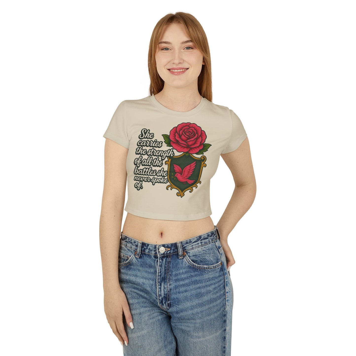 SHE CARRIES THE STRENGTH OF ALL THE BATTLES SHE NEVER SPOKE OF Women's Baby Tee