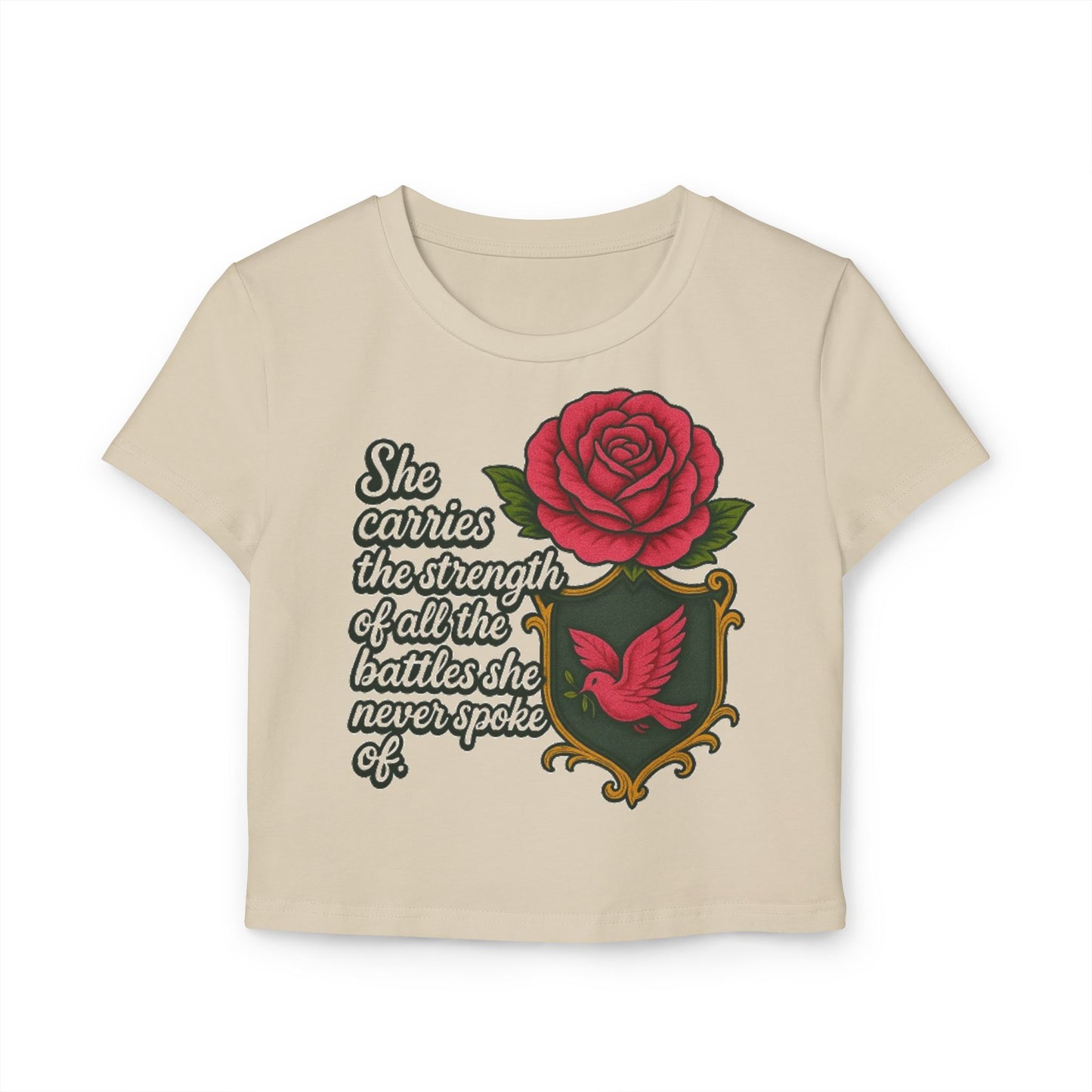 SHE CARRIES THE STRENGTH OF ALL THE BATTLES SHE NEVER SPOKE OF Women's Baby Tee