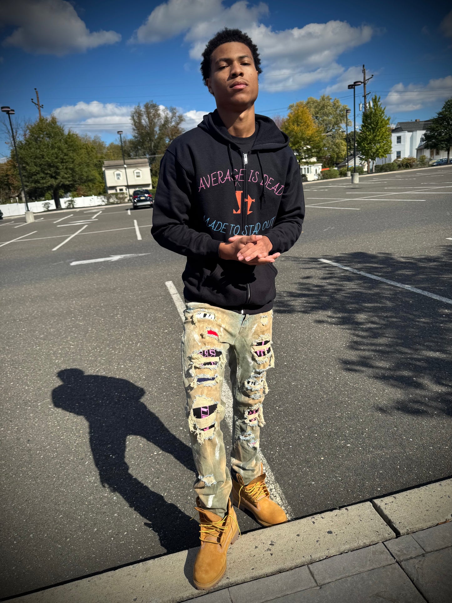 Jt Apparel "Average Is Dead, Made To Stand Out" Multi Color Cross Eyes Emoji Design Zip Up