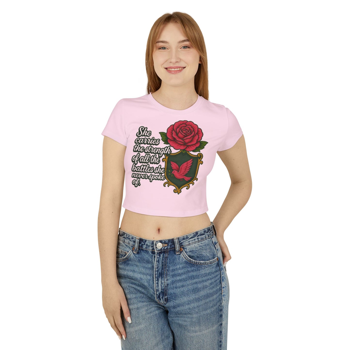 SHE CARRIES THE STRENGTH OF ALL THE BATTLES SHE NEVER SPOKE OF Women's Baby Tee