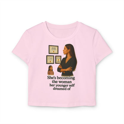 SHES BECOMING THE WOMEN HER YOUNGER SELF DREAMED OF Women's Baby Tee