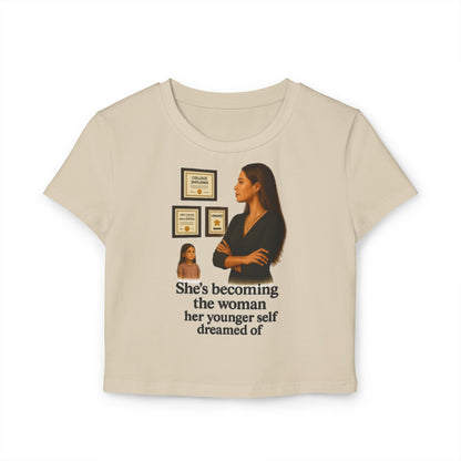 SHES BECOMING THE WOMEN HER YOUNGER SELF DREAMED OF Women's Baby Tee