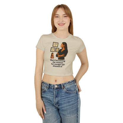 SHES BECOMING THE WOMEN HER YOUNGER SELF DREAMED OF Women's Baby Tee